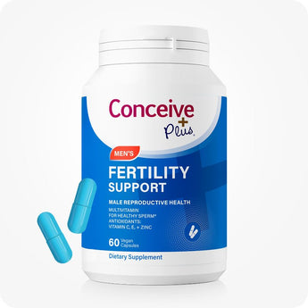 For Conceive Plus Fertility Support Bundle for Him and Her, displaying men's fertility support supplement bottle in blue packaging with 60 vegan capsules, featuring antioxidant support for sperm health; two blue capsules are positioned beside container to show actual capsules form against white background.